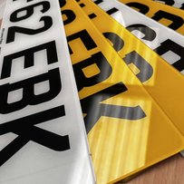 a stack of number plates