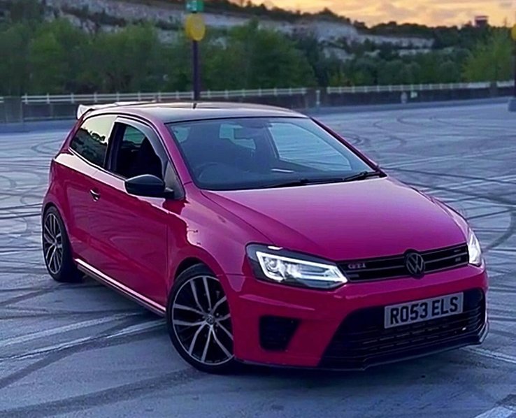 red car with tinted number plate